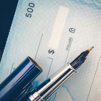 Photo of check with a pen