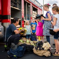 photo of special event presentation to group of children