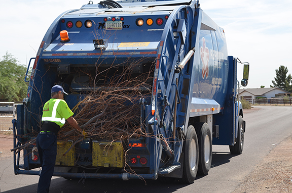 garbage truck collecting bulk trash