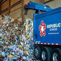 Garbage truck dropping off load at the landfill