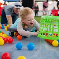 child participating in Halloween Carnival event