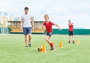 A Guy Coaching Kids