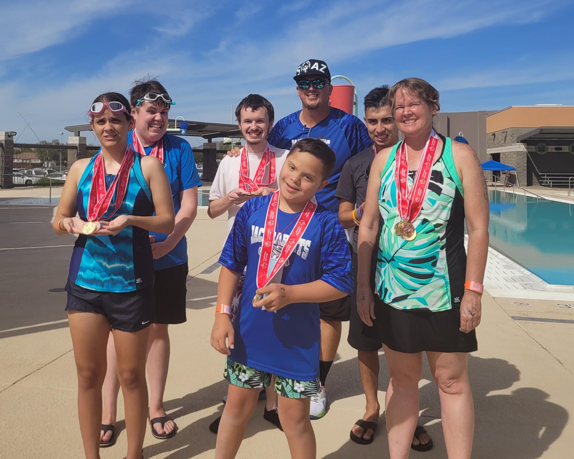 Special Olympics Swim team with medals